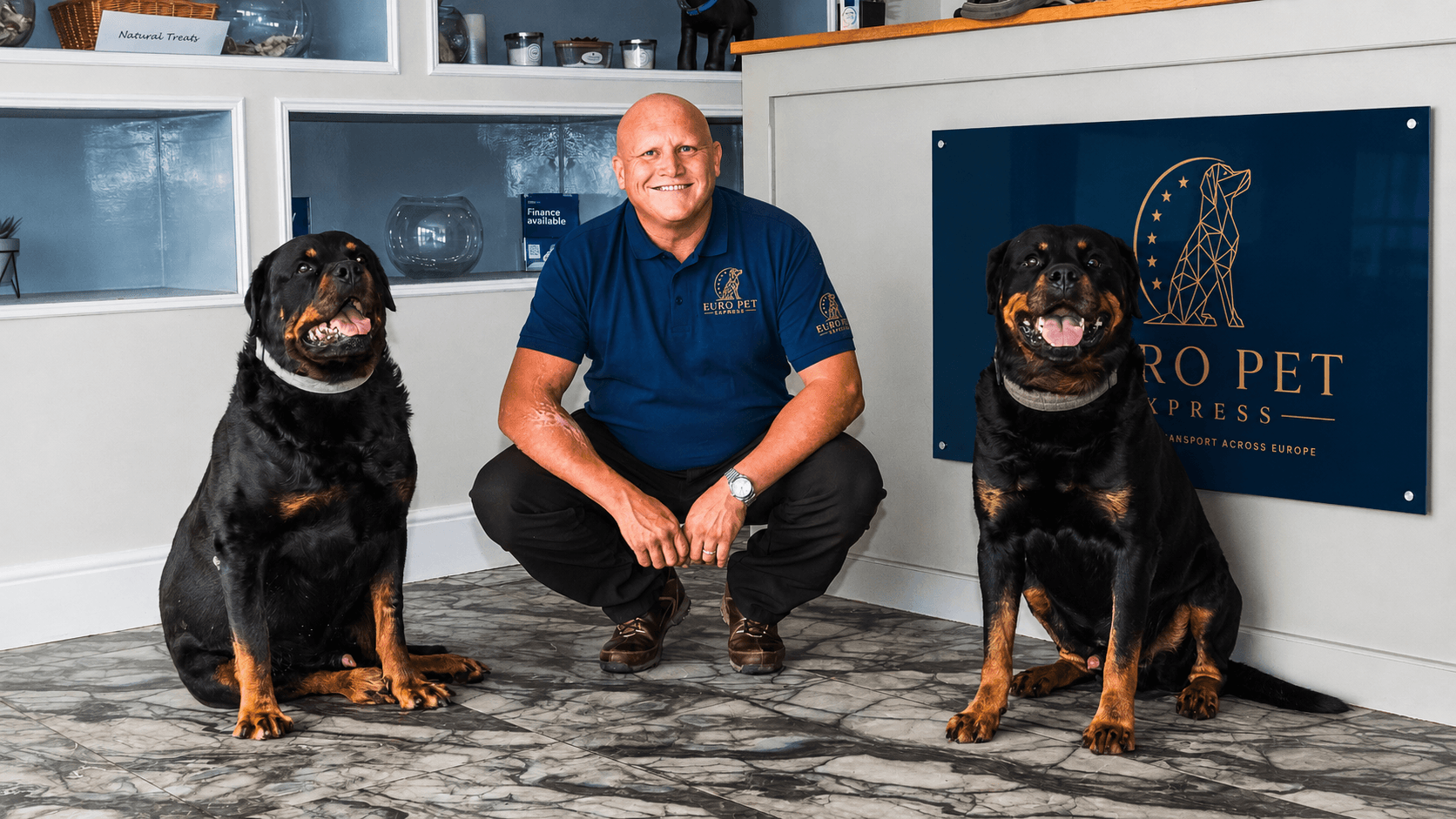 Euro Pet Express founder with two dogs at the company office